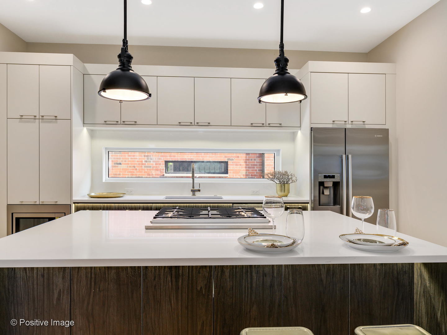 6915 North Western Avenue, Unit 2 Chicago, IL 60645 - Photo 12 of 25 a kitchen with a sink a stove and cabinets
