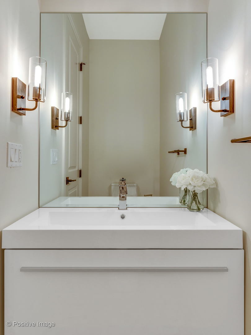 6915 North Western Avenue, Unit 2 Chicago, IL 60645 - Photo 13 of 25 a bathroom with a sink