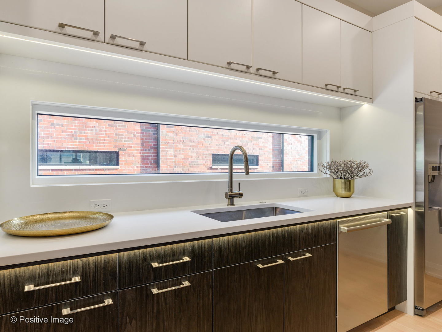 6915 North Western Avenue, Unit 2 Chicago, IL 60645 - Photo 14 of 25 a kitchen with a sink and a window