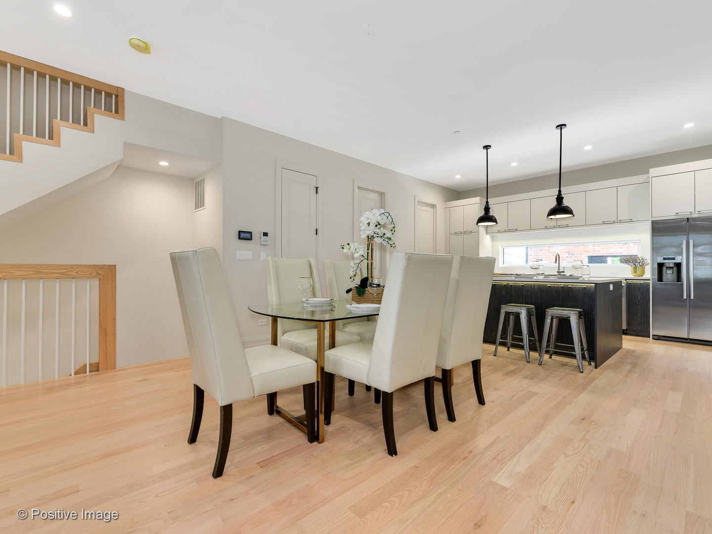 6915 North Western Avenue, Unit 2 Chicago, IL 60645 - Photo 4 of 25 a view of a dining room with furniture and wooden floor