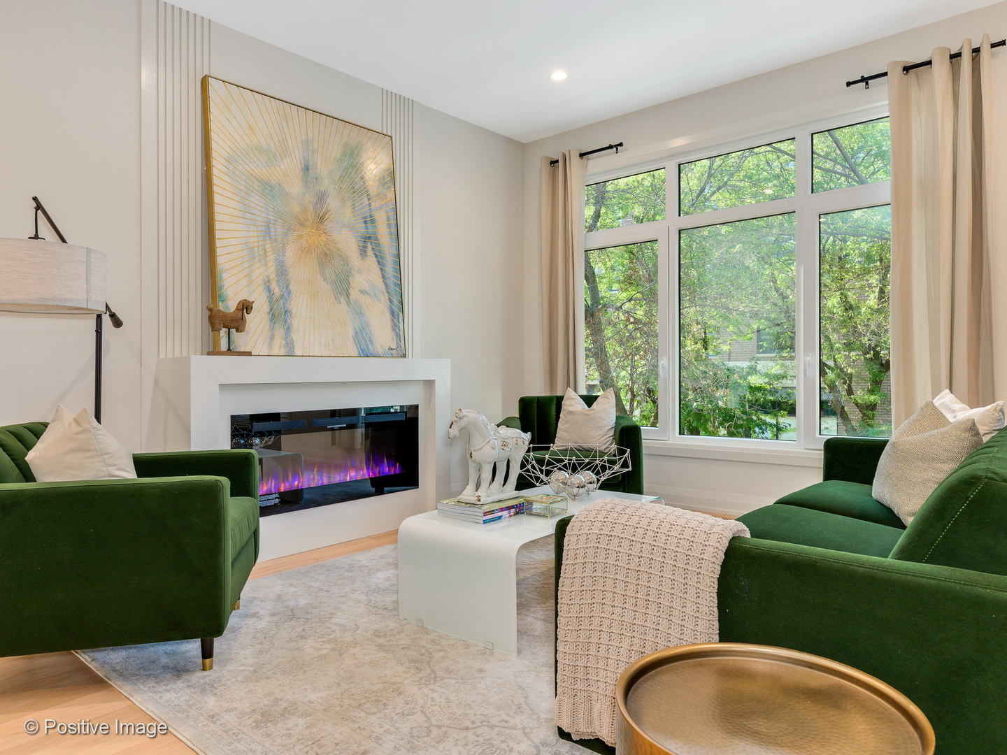 6915 North Western Avenue, Unit 2 Chicago, IL 60645 - Photo 6 of 25 a living room with furniture a large window and a fireplace