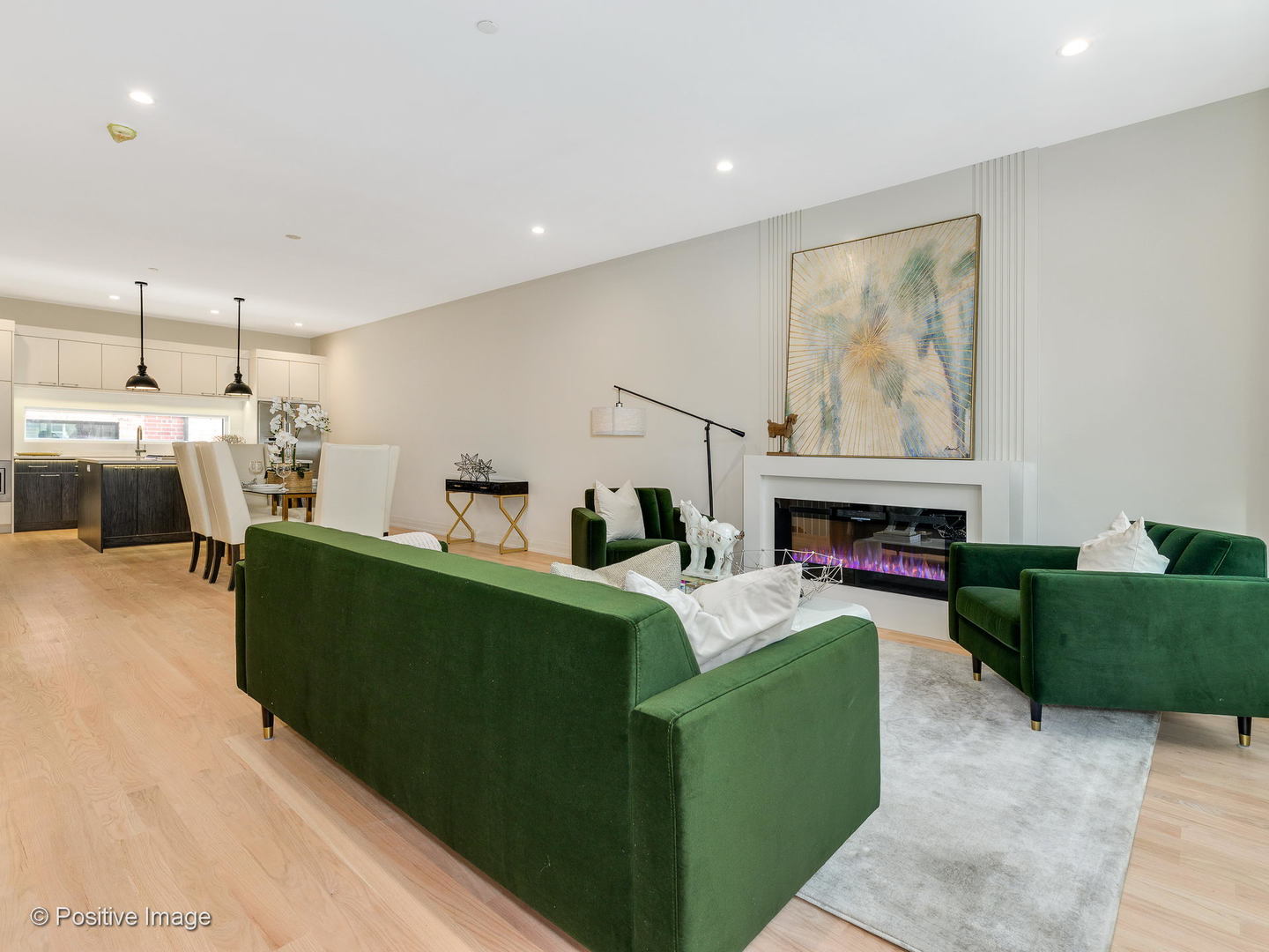6915 North Western Avenue, Unit 2 Chicago, IL 60645 - Photo 8 of 25 a living room with furniture a fireplace and a kitchen view