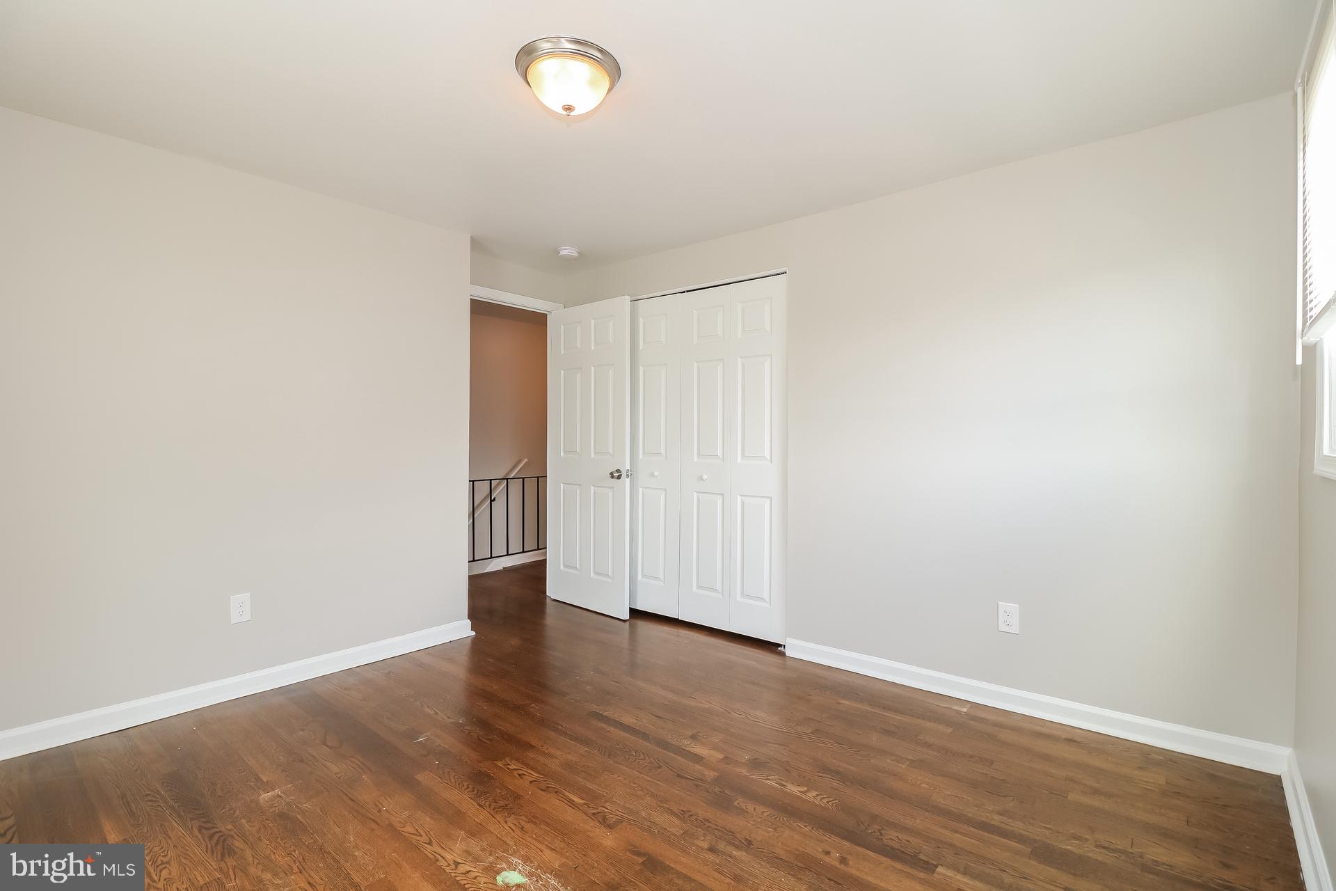 5674 Leiden Road Baltimore, MD 21206 - Photo 12 of 14 a view of an empty room with wooden floor