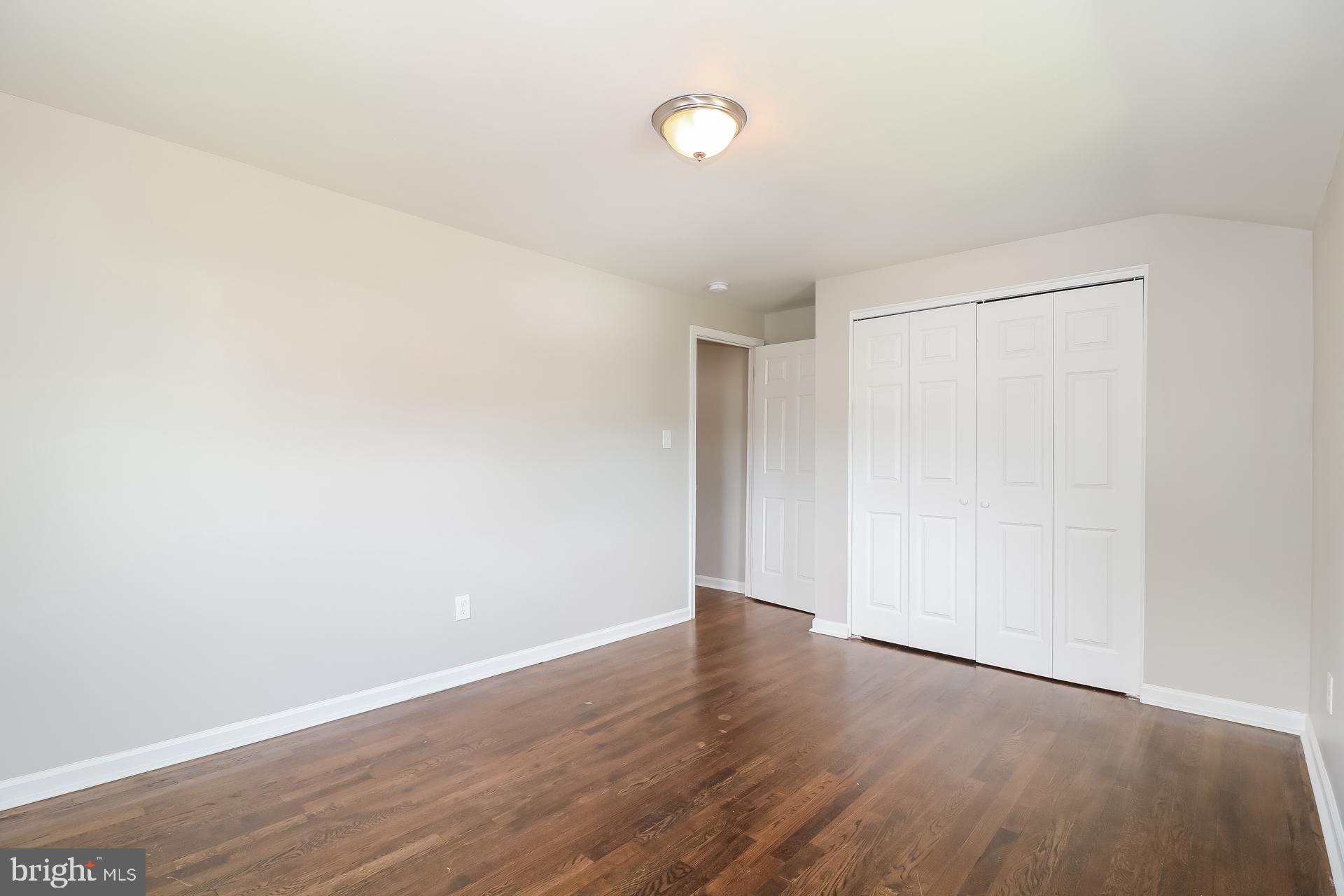 5674 Leiden Road Baltimore, MD 21206 - Photo 9 of 14 a view of an empty room with wooden floor