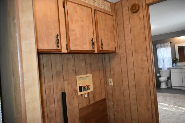 a view of a bathroom with a window and a potted plant