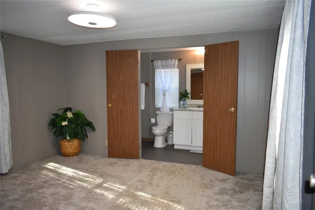 a view of a hallway and a potted plant