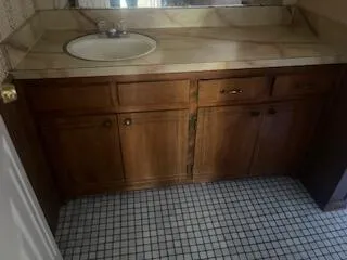 a view of a yard with wooden fence