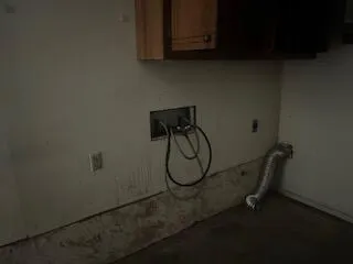 a view of a large house with a big yard and large trees