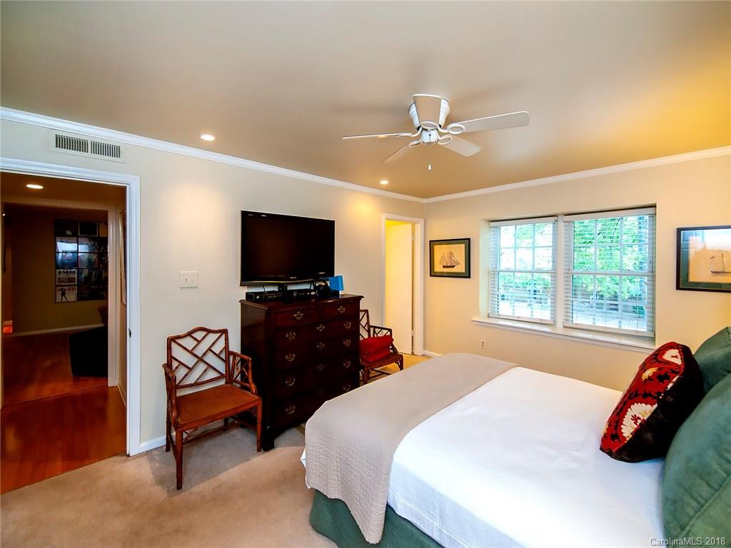 1712 Roxborough Road, Unit E Charlotte, NC 28211 - Photo 14 of 23 a bedroom with a bed and a flat screen tv