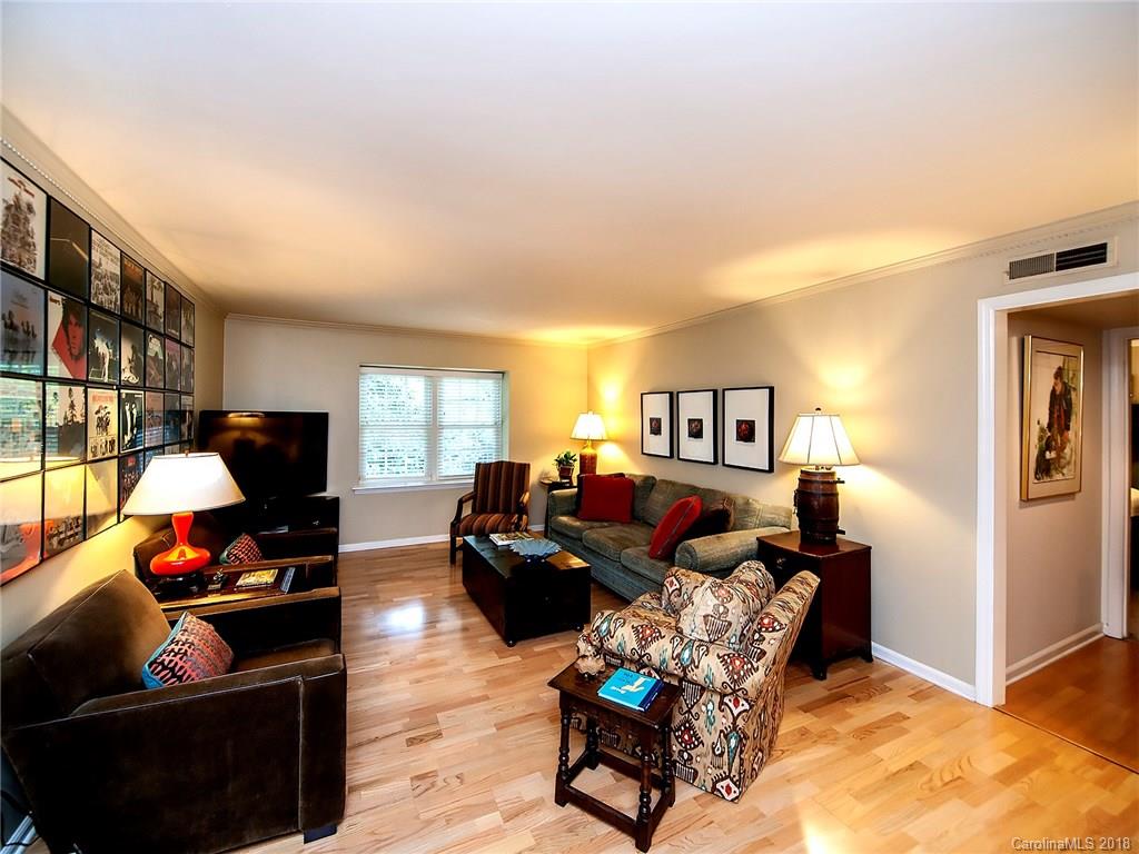 1712 Roxborough Road, Unit E Charlotte, NC 28211 - Photo 3 of 23 a living room with furniture and a flat screen tv