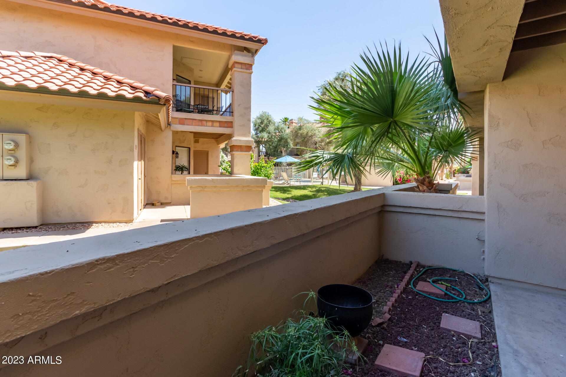 9711 East Mountain View Road, Unit 1502 Scottsdale, AZ 85258 - Photo 27 of 42 1502 patio view to the pool