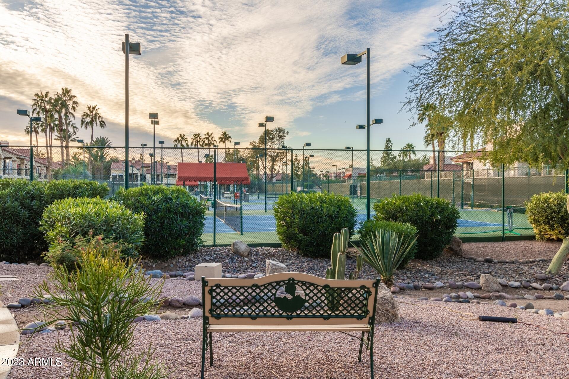 9711 East Mountain View Road, Unit 1502 Scottsdale, AZ 85258 - Photo 29 of 43 a view of a chair and table in the garden
