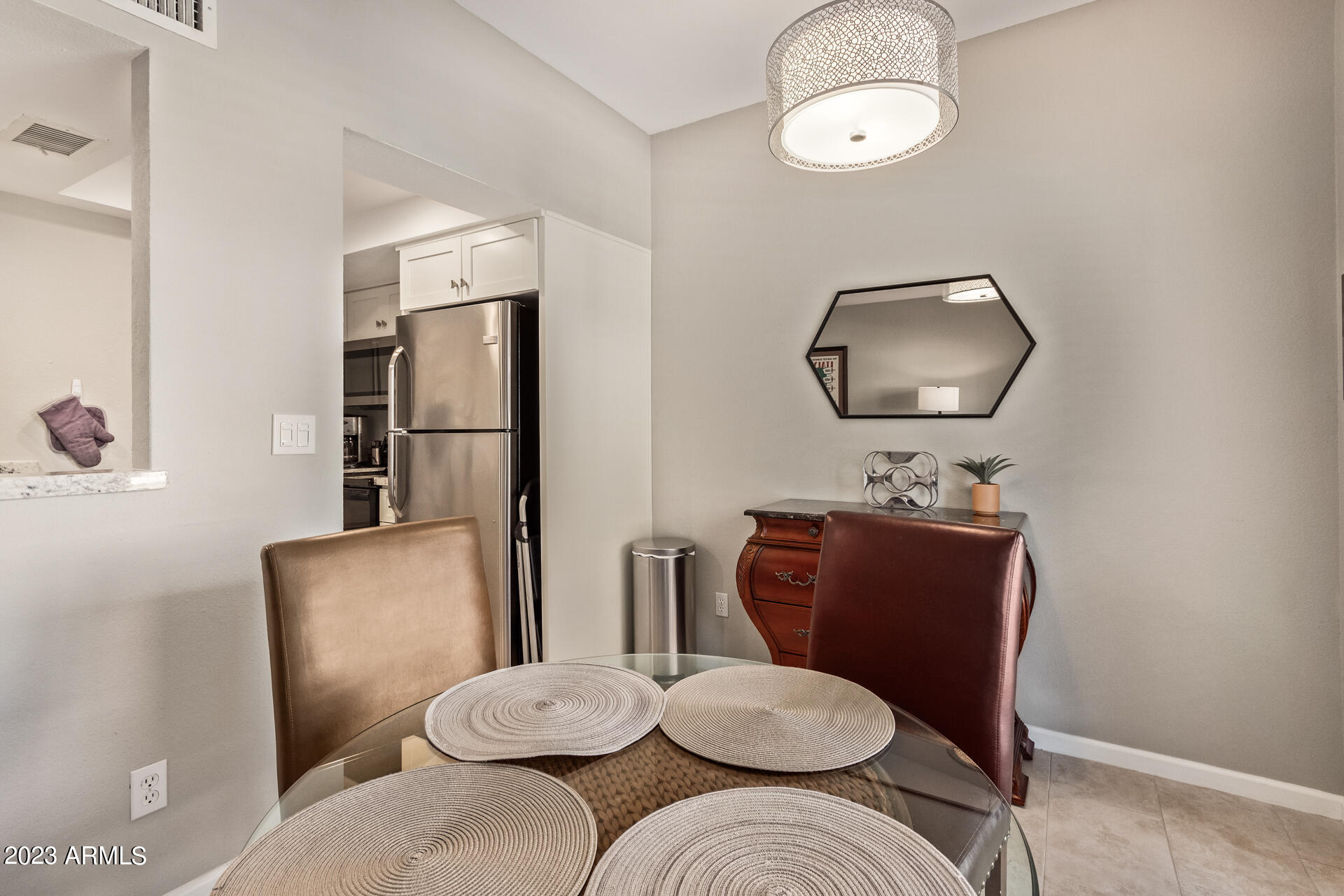 9711 East Mountain View Road, Unit 1502 Scottsdale, AZ 85258 - Photo 9 of 42 1502 dining room. kitchen entrance