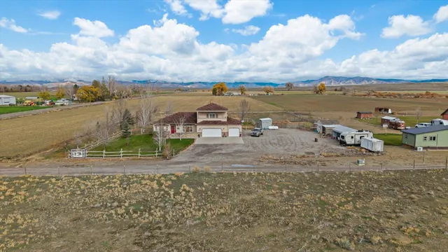 an aerial view of a house with outdoor space