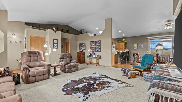 a view of a dining room with furniture and a rug