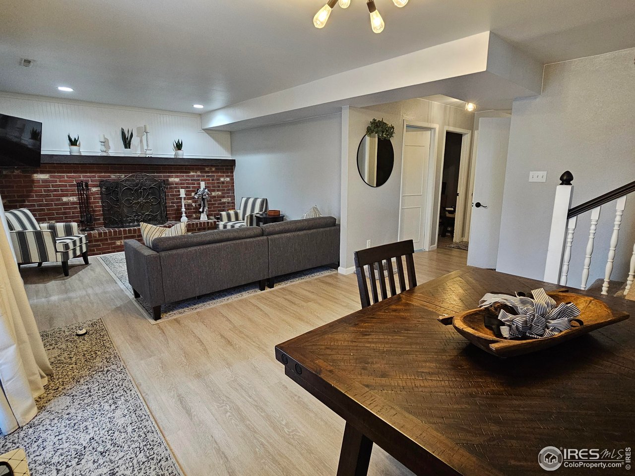 511 Pawnee Drive Sterling, CO 80751 - Photo 25 of 45 Ground level family room with fireplace; ground level also includes a 3/4 bath, office and mud room