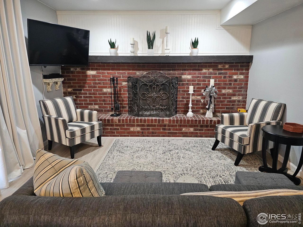 511 Pawnee Drive Sterling, CO 80751 - Photo 27 of 50 Family room fireplace