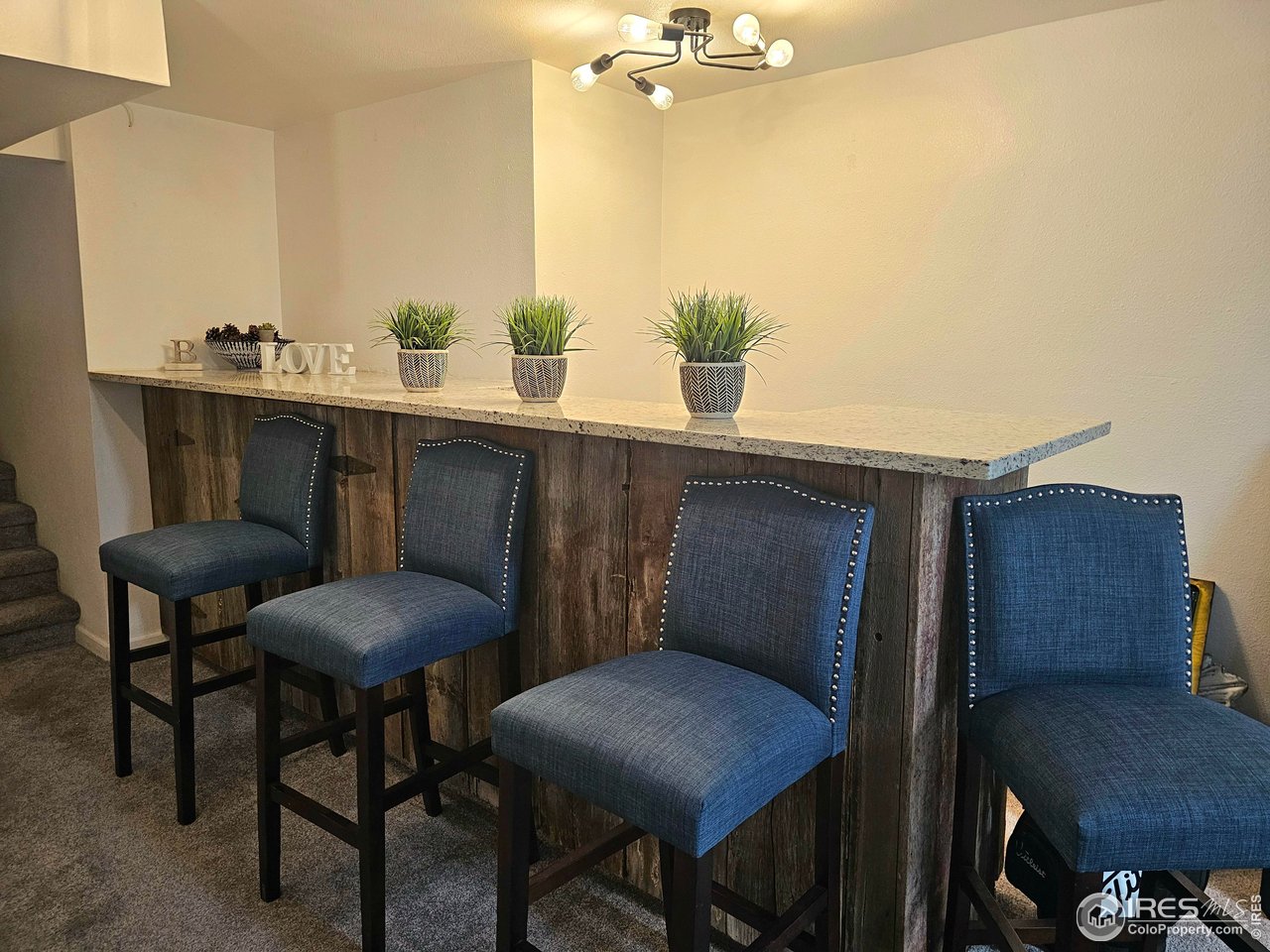 511 Pawnee Drive Sterling, CO 80751 - Photo 32 of 50 Bar in the great room is convenient for entertaining