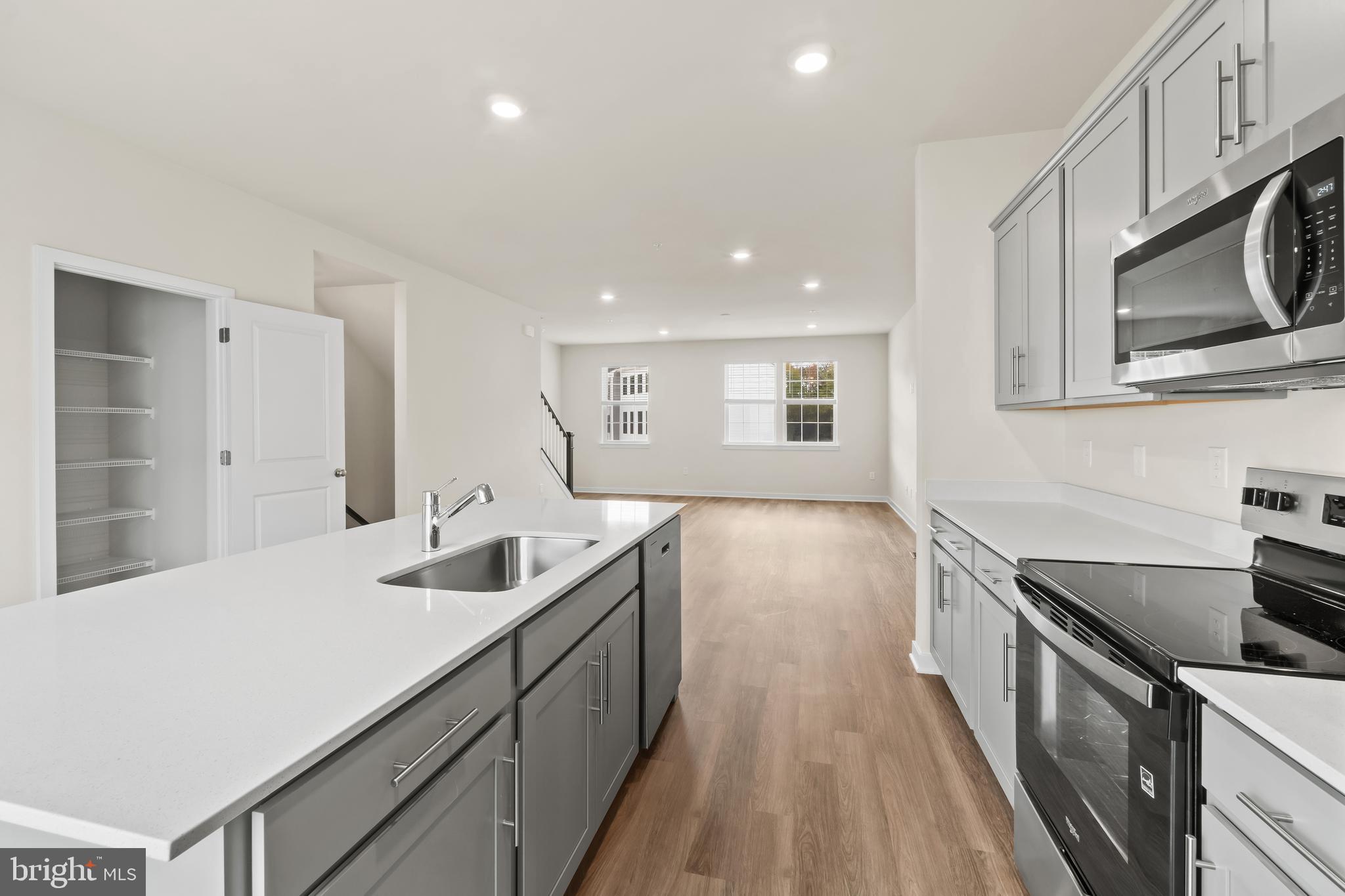 238 Soft Rush Lane La Plata, MD 20646 - Photo 12 of 33 a kitchen with stainless steel appliances granite countertop a sink stove and cabinets