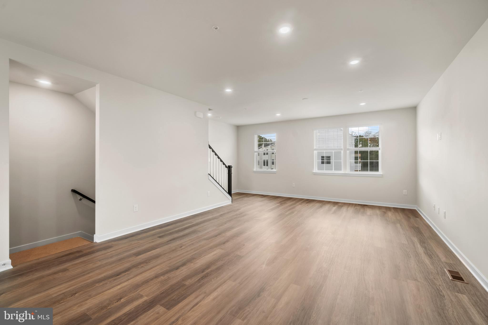 238 Soft Rush Lane La Plata, MD 20646 - Photo 14 of 33 an empty room with wooden floor and windows