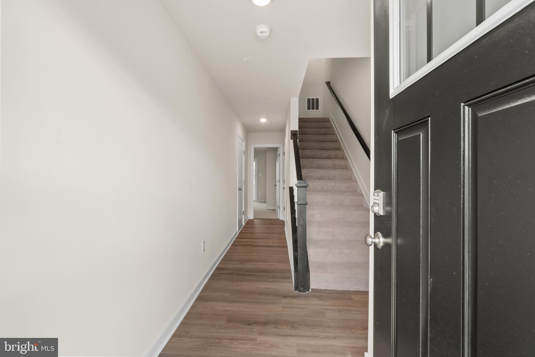 238 Soft Rush Lane La Plata, MD 20646 - Photo 2 of 33 a view of entryway and hall with wooden floor