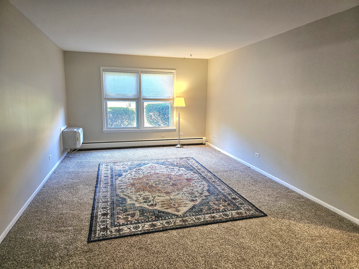 350 Brainerd Avenue, Unit 7A Libertyville, IL 60048 - Photo 3 of 9 an empty room with windows
