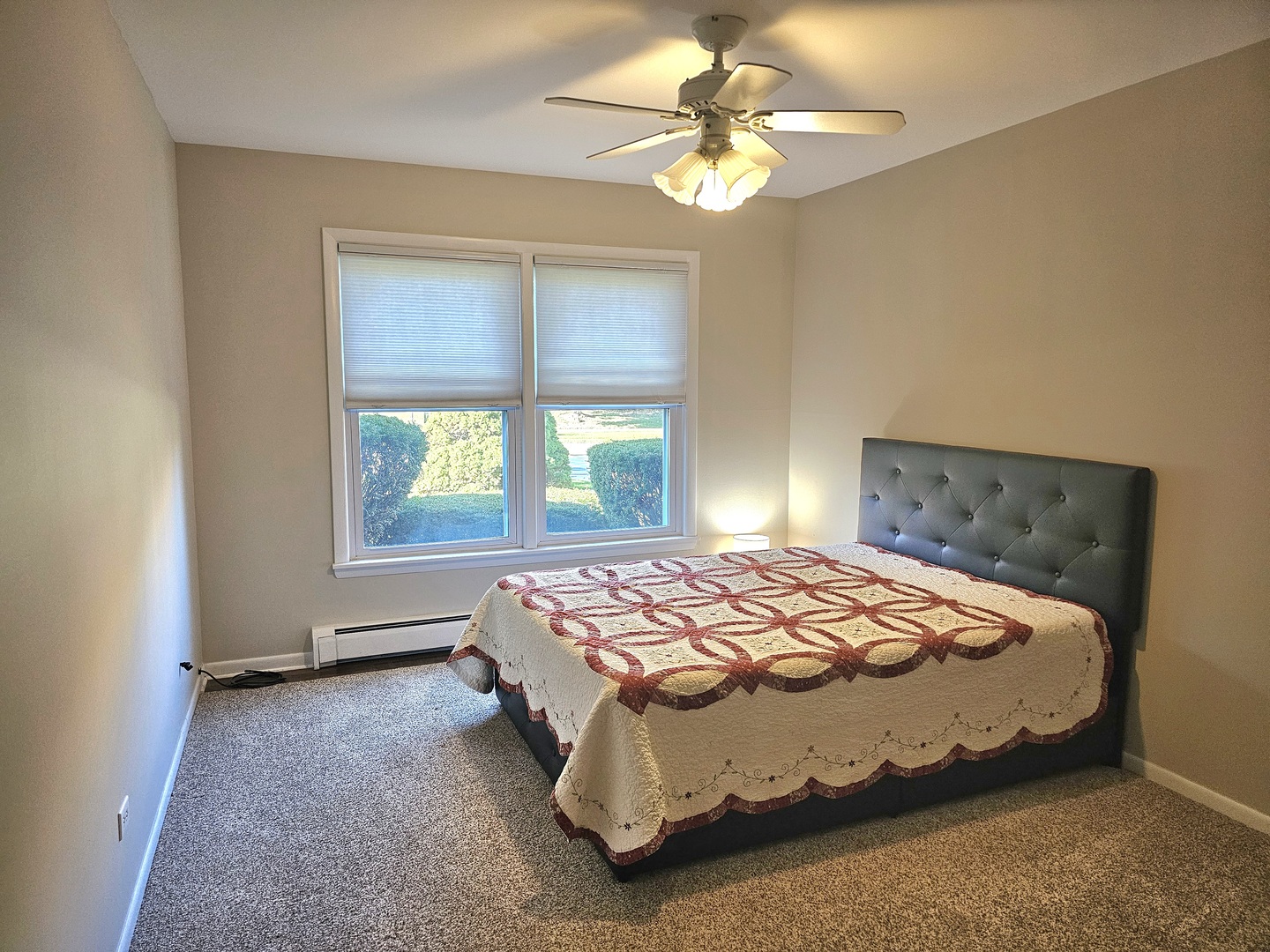 350 Brainerd Avenue, Unit 7A Libertyville, IL 60048 - Photo 6 of 9 a bedroom with a bed and a window