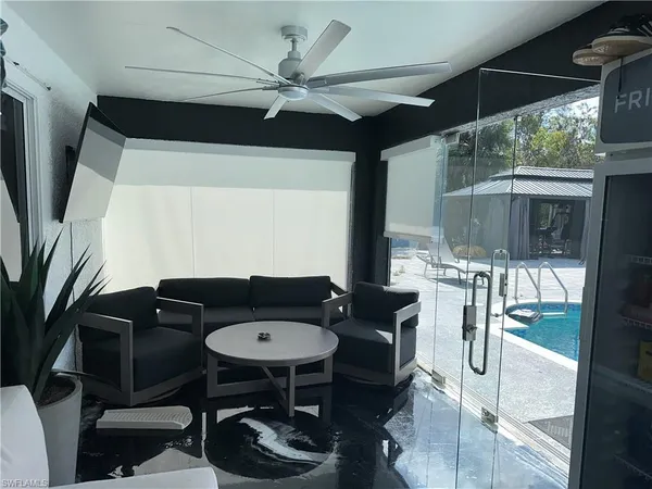 a balcony view with a table and chairs