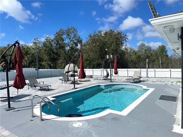 a view of a swimming pool with a patio