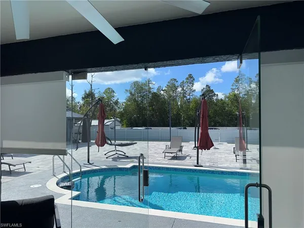 a view of a backyard with a sitting area