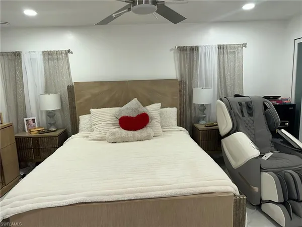 a bedroom with a bed and teddy bear