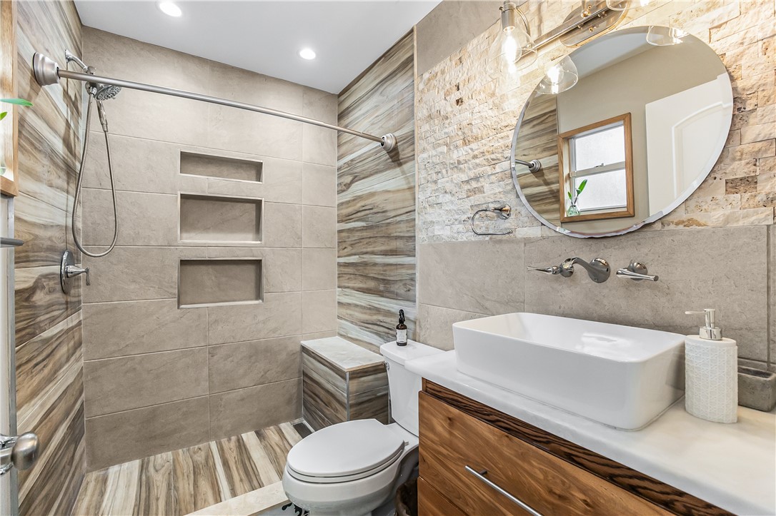 762 Bayharbor Terrace Sebastian, FL 32958 - Photo 12 of 24 a bathroom with a sink a toilet and shower