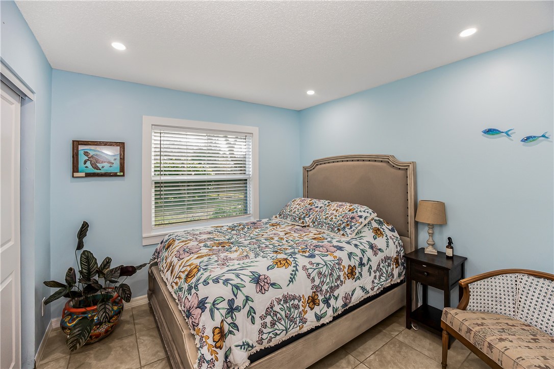 762 Bayharbor Terrace Sebastian, FL 32958 - Photo 13 of 24 a bedroom with a bed and a window