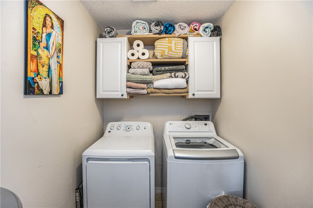 762 Bayharbor Terrace Sebastian, FL 32958 - Photo 22 of 24 a utility room with dryer and washer