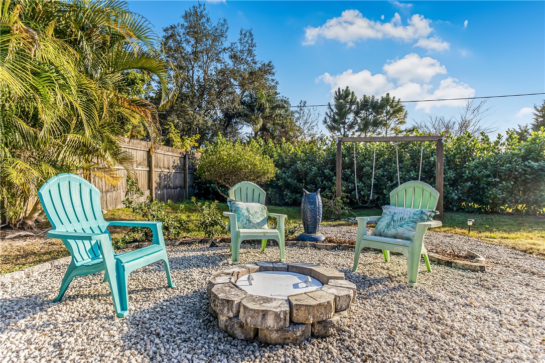 762 Bayharbor Terrace Sebastian, FL 32958 - Photo 4 of 24 a view of a chairs and table in backyard