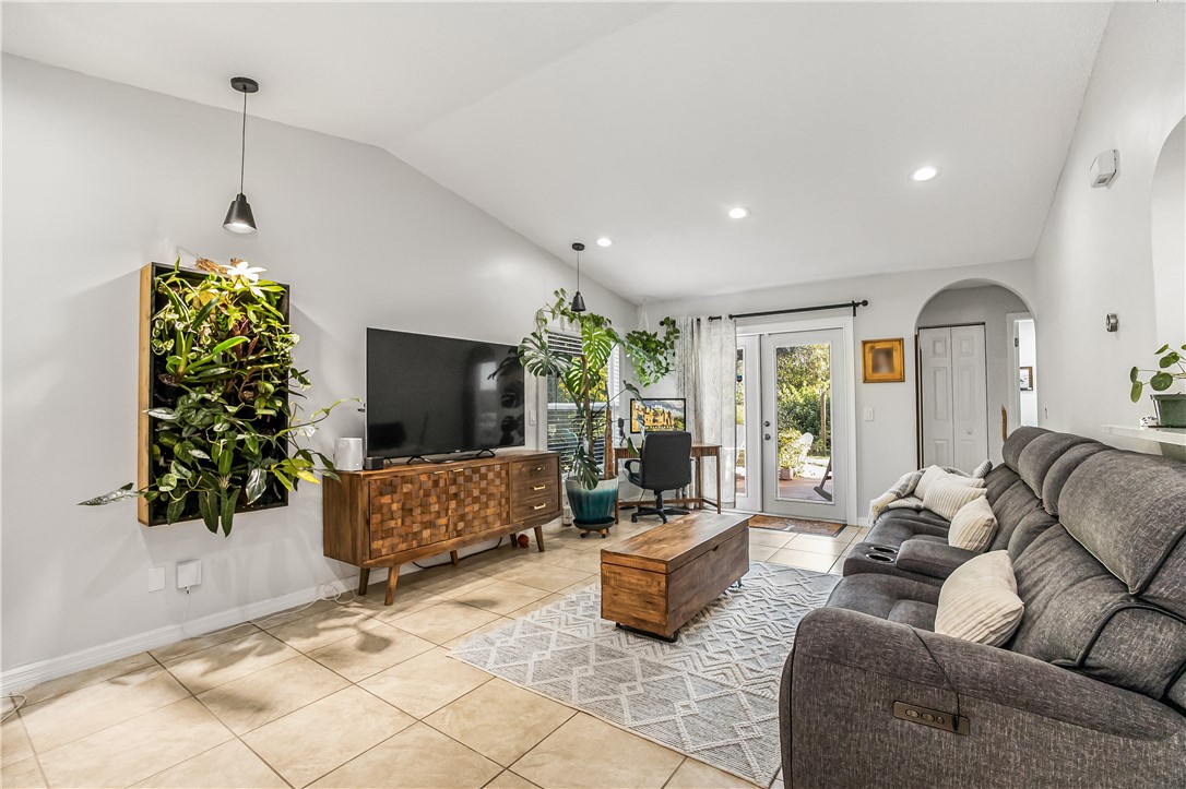 762 Bayharbor Terrace Sebastian, FL 32958 - Photo 6 of 24 a living room with furniture and a flat screen tv