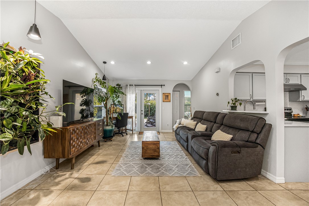 762 Bayharbor Terrace Sebastian, FL 32958 - Photo 7 of 24 a living room with furniture and a potted plant
