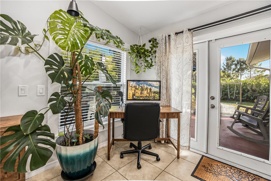 762 Bayharbor Terrace Sebastian, FL 32958 - Photo 8 of 24 a view of a workspace with furniture and a potted plant