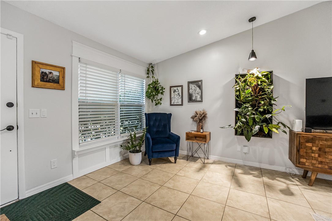 762 Bayharbor Terrace Sebastian, FL 32958 - Photo 9 of 24 a living room with furniture and a flat screen tv