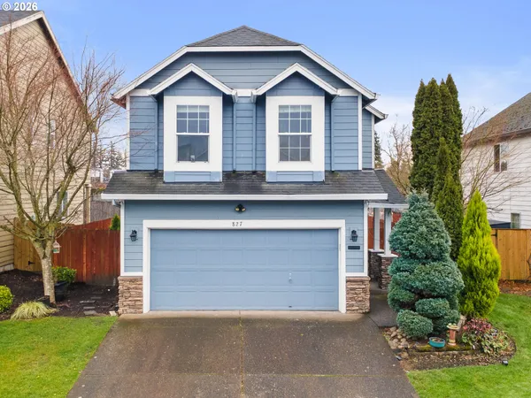 a front view of a house with a garage