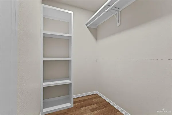 a view of an empty walk in closet