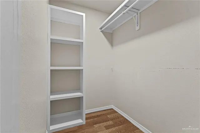 a view of an empty walk in closet