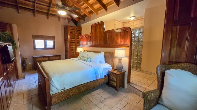 a bed sitting in a room next to a window