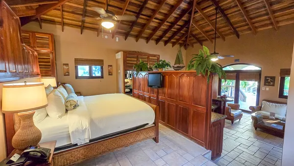 a bed room with a bed and a chandelier