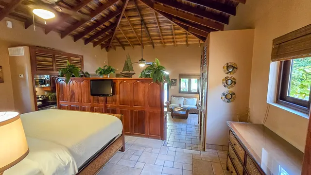 a bed room with a bed and a chandelier