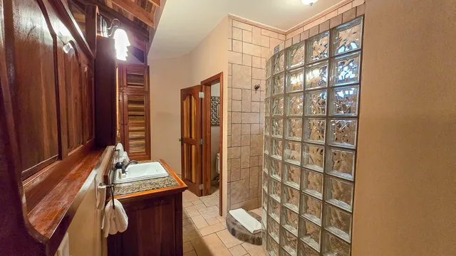 a view of a hallway with paintings on the wall