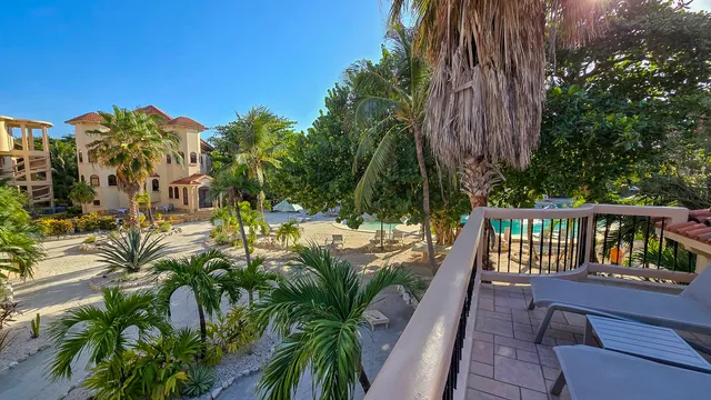 a view of balcony with furniture