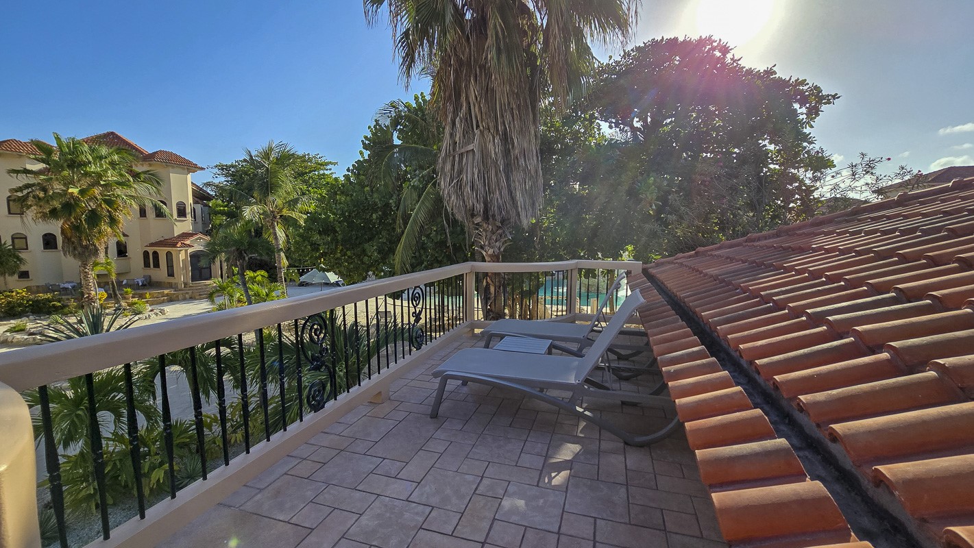 1.3 Miles North San Pedro, Unit CASITA1 Robstown, TX 78380 - Photo 21 of 37 a view of a balcony with wooden floor and fence