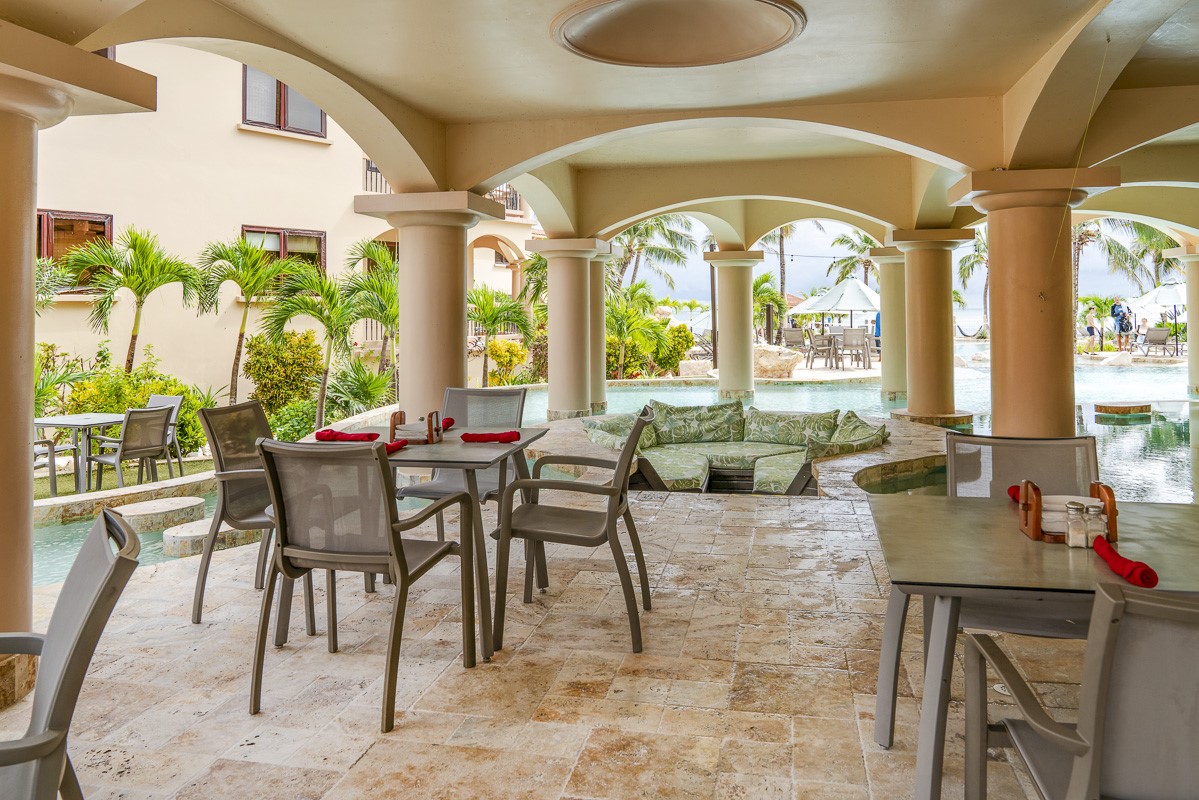 1.3 Miles North San Pedro, Unit CASITA1 Robstown, TX 78380 - Photo 27 of 37 a view of a dining room with furniture a chandelier and wooden floor