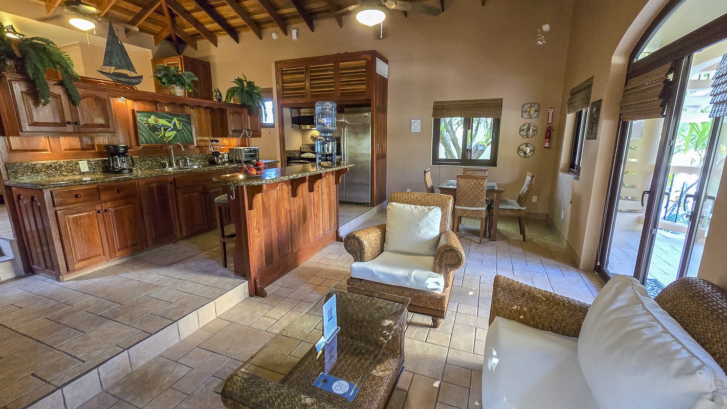 1.3 Miles North San Pedro, Unit CASITA1 Robstown, TX 78380 - Photo 3 of 37 a living room with furniture a dining table and wooden floor